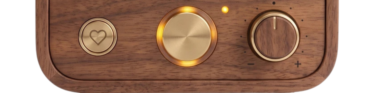 Roomie's three controls: a heart button for family messages, an illuminated talk button, and a volume knob.